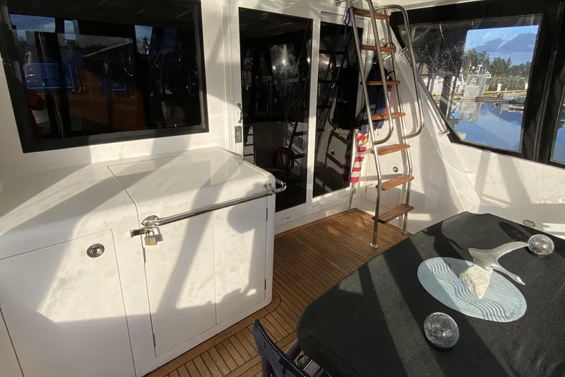 Slide: The Image of Interior of 2000 Compass 55 yacht with wooden flooring and modern decor. - 6