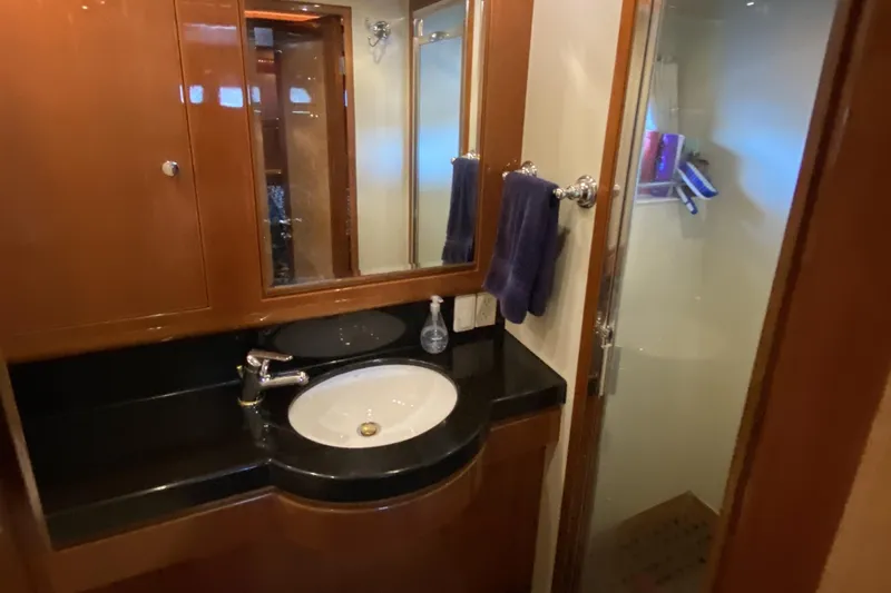 Slide: The Image of Luxurious bathroom in 2000 Compass 55 yacht with sleek sink and shower. - 62