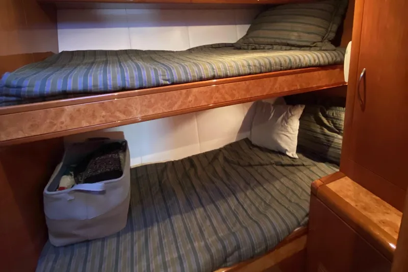Slide: The Image of Compact cabin with wooden bunk beds in a 2000 Compass 55 model. - 71
