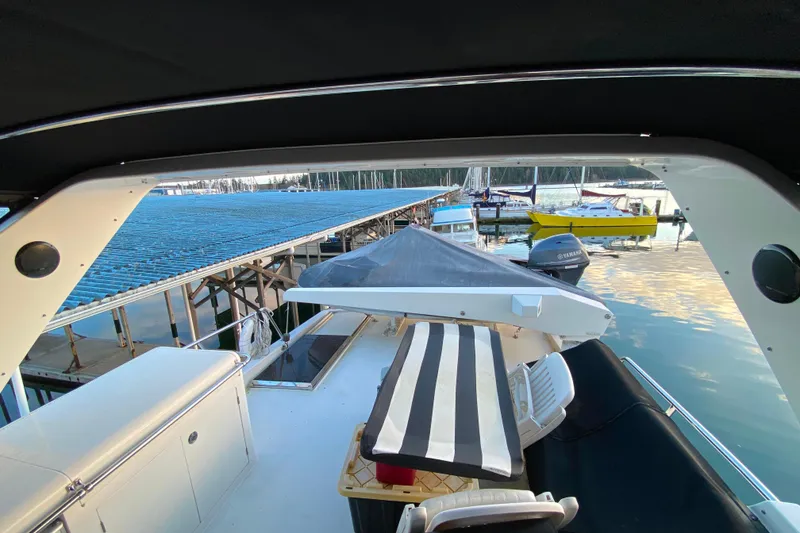Slide: The Image of View from a 2000 Compass 55 boat, docked at a marina with surrounding vessels. - 78
