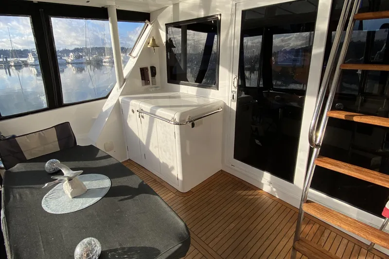 Slide: The Image of Interior of 2000 Compass 55 yacht with wooden flooring and modern decor. - 9