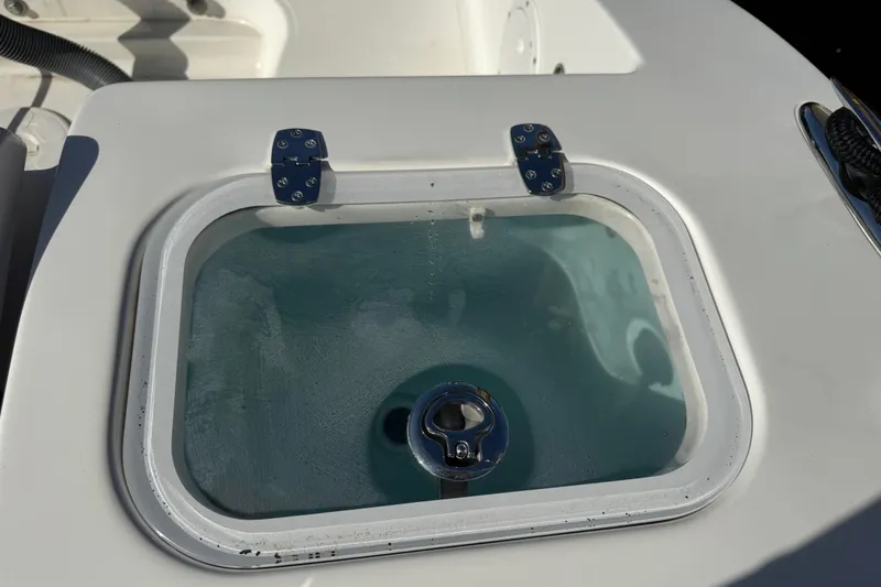 Slide: The Image of Livewell on 2022 Pursuit DC 266 Dual Console boat, filled with water. - 30