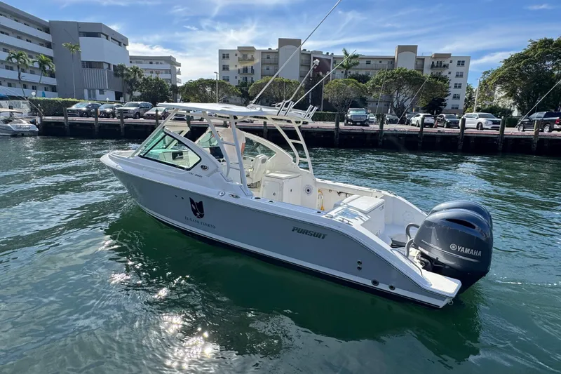 Slide: The Image of 2022 Pursuit DC 266 Dual Console boat with Yamaha engine on calm water. - 6