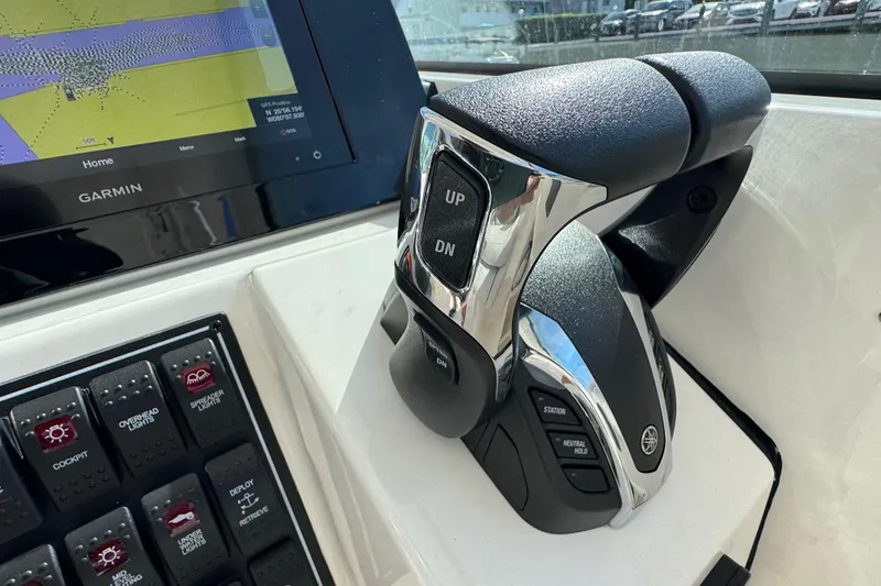 Slide: The Image of Control panel of 2022 Pursuit DC 266 Dual Console boat with Garmin display. - 64