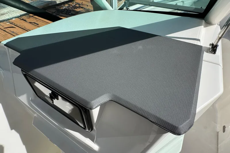 Slide: The Image of 2022 Pursuit DC 266 Dual Console boat dashboard with textured cover. - 65