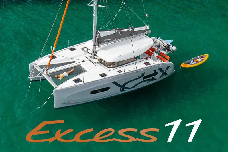 The Image of Aerial view of 2026 Excess 11 catamaran on turquoise water with kayak. - 0