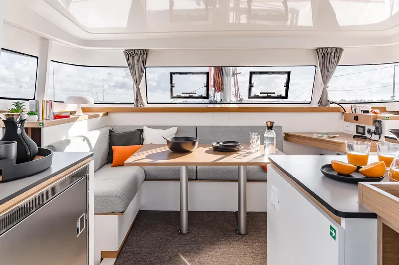 Slide: The Image of Luxurious interior of 2026 Excess 11 yacht with modern dining area and panoramic windows. - 20