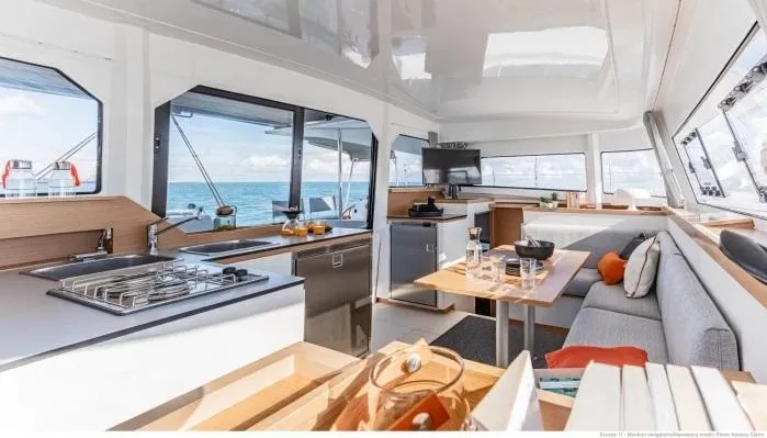 Slide: The Image of Manufacturer Provided Image: Luxurious interior of 2026 Excess 11 catamaran with modern kitchen and seating area. - 4