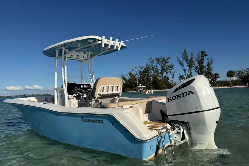 Slide: The Image of 2019 Tidewater 220 LXF boat with Honda engine in clear water, sunny day. - 12