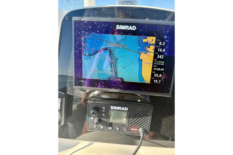 Slide: The Image of Simrad navigation system on 2019 Tidewater 220 LXF boat, displaying marine map and data. - 14