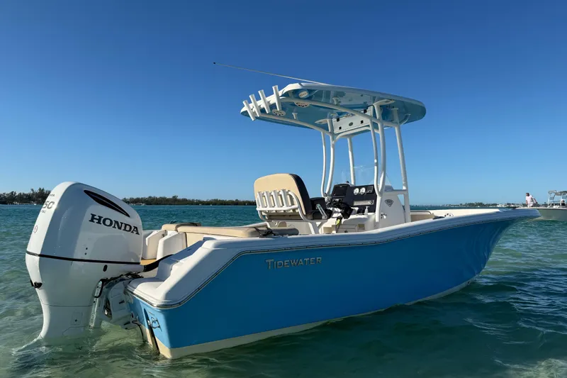 Slide: The Image of 2019 Tidewater 220 LXF boat with Honda engine on clear water. - 16