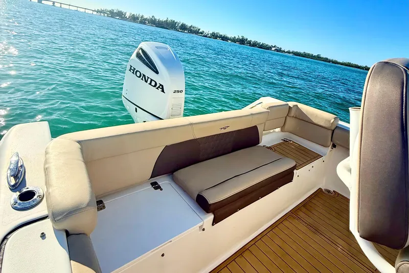 Slide: The Image of 2019 Tidewater 220 LXF boat with Honda 250 engine on calm water. - 6