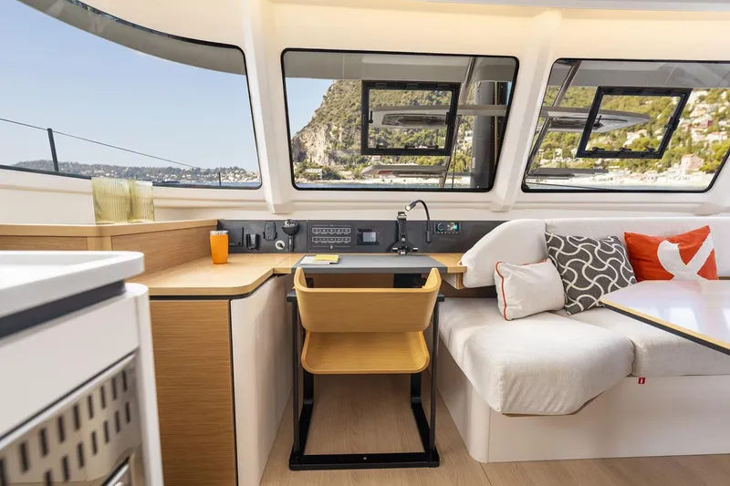 Slide: The Image of Manufacturer Provided Image: Luxurious interior of 2026 Excess 13 yacht with modern seating and scenic windows. - 14