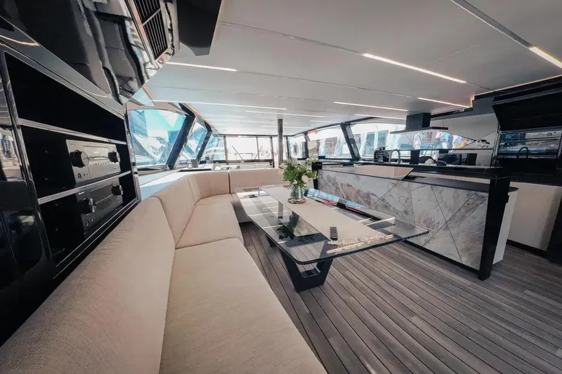 Slide: The Image of Steering wheel of 2024 Wave Wave60 yacht with modern dashboard and cityscape view. - 11