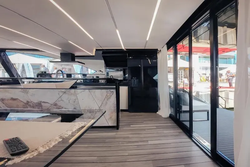 Slide: The Image of Luxurious 2024 Wave Wave60 yacht deck with modern seating and sleek design. - 15