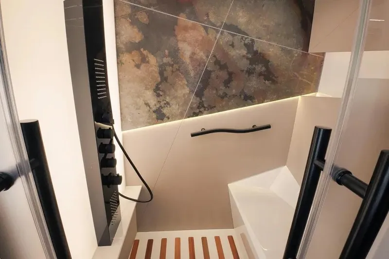 Slide: The Image of Luxurious Wave60 2024 shower interior with modern design and elegant stone-patterned wall. - 33