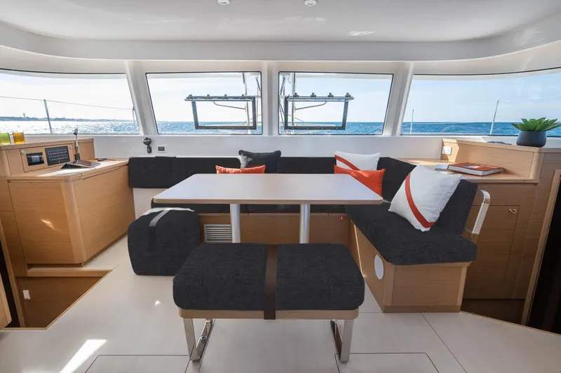 Slide: The Image of Manufacturer Provided Image: Luxurious interior of 2026 Excess 14 catamaran with modern seating and ocean view. - 5