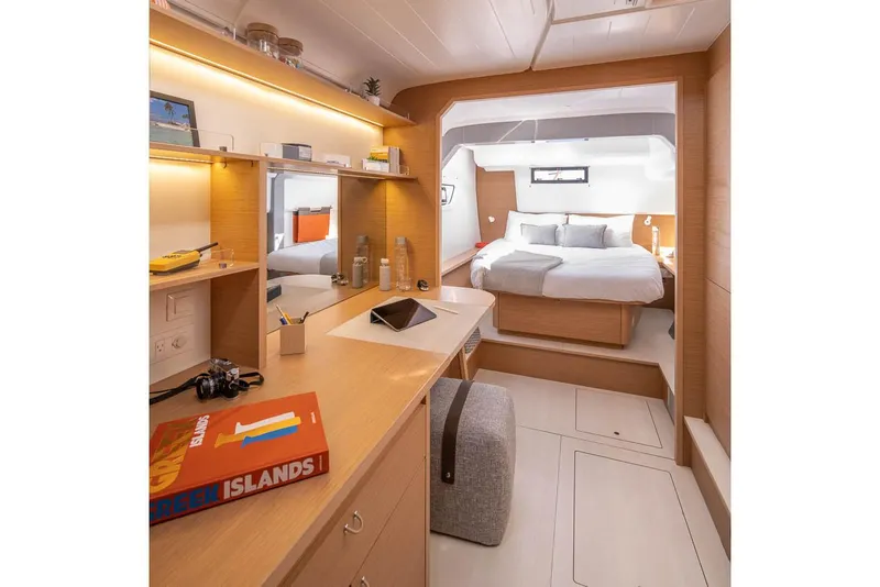 Slide: The Image of Manufacturer Provided Image: Luxurious interior of 2026 Excess 14 yacht with modern bedroom and workspace. - 7