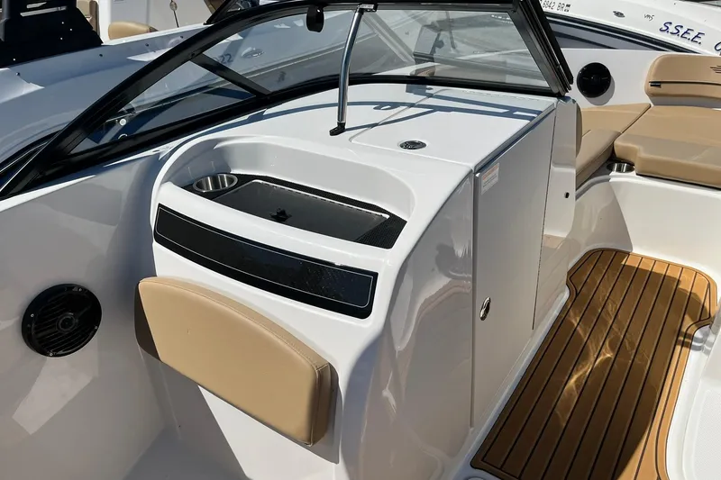 Slide: The Image of 2026 Bayliner VR6 Bowrider OB interior with sleek seating and modern design. - 11