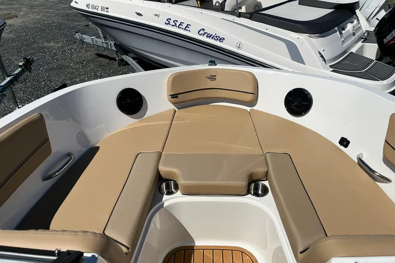 Slide: The Image of 2026 Bayliner VR6 Bowrider OB with tan seating and sleek design. - 15