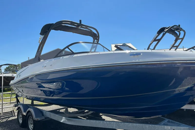 Slide: The Image of 2026 Bayliner VR6 Bowrider OB on trailer under clear blue sky. - 5