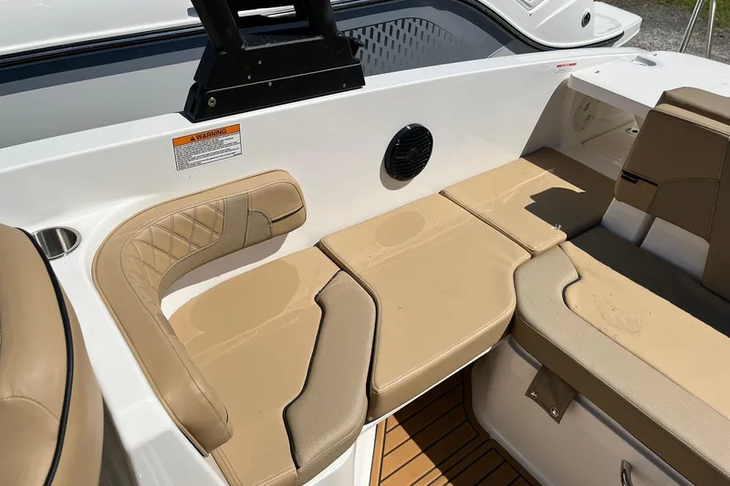 Slide: The Image of 2026 Bayliner VR6 Bowrider OB interior with beige seating and modern design. - 9