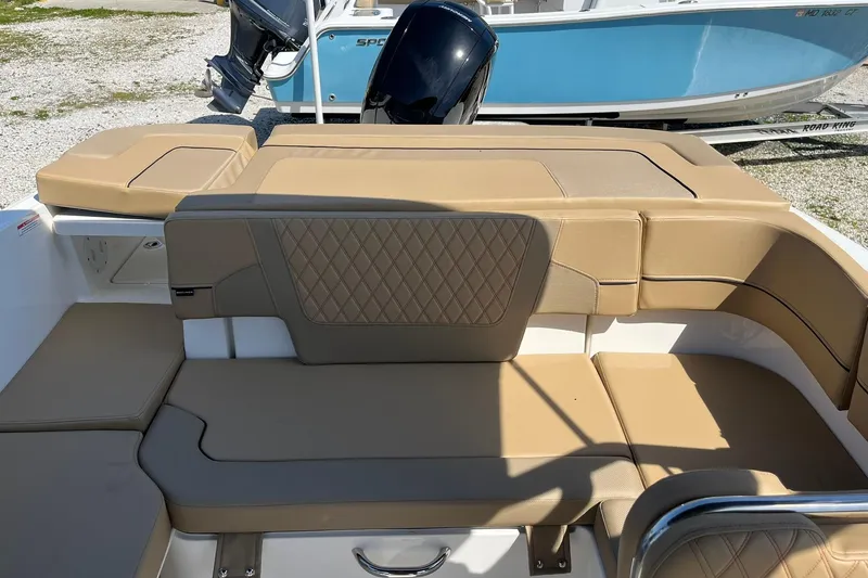 Slide: The Image of 2026 Bayliner VR6 Bowrider OB with tan leather seating and sleek design. - 10