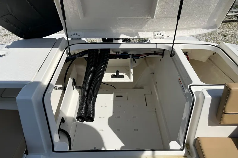 Slide: The Image of Open engine compartment of 2026 Bayliner VR6 Bowrider OB boat. - 13