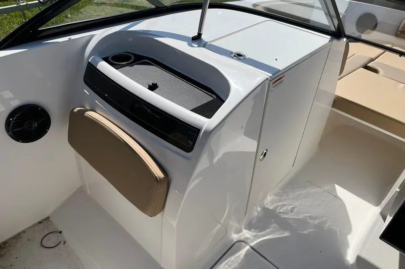 Slide: The Image of 2026 Bayliner VR6 Bowrider OB interior with seating and storage compartments. - 15
