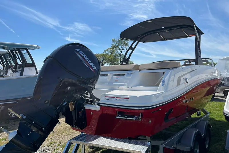 Slide: The Image of 2026 Bayliner VR6 Bowrider OB with Mercury outboard engine, displayed outdoors. - 7