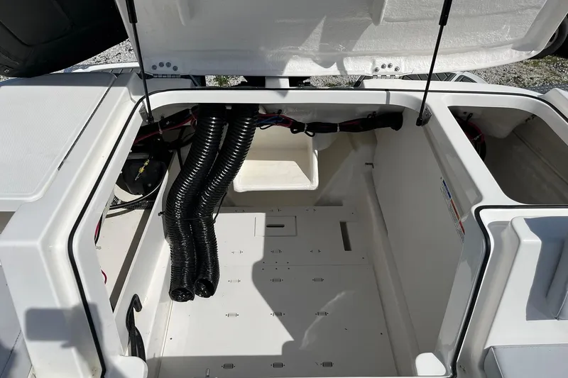 Slide: The Image of Open engine compartment of 2026 Bayliner VR6 Bowrider OB boat. - 11