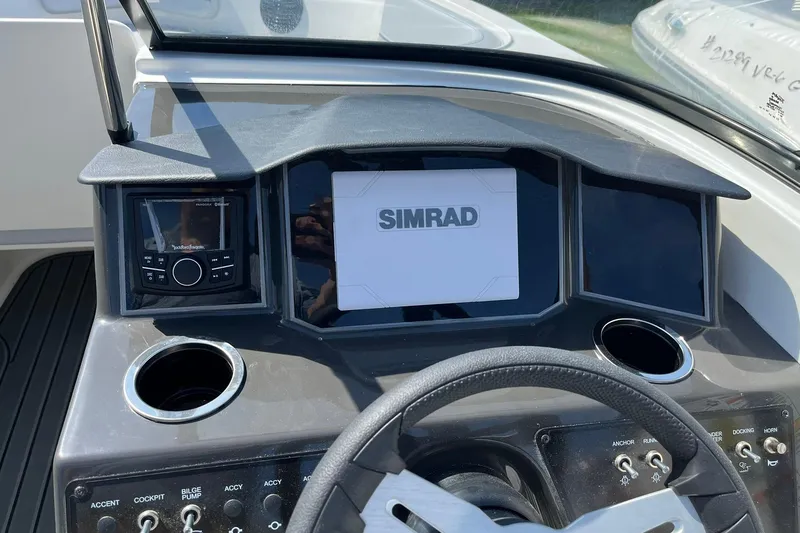 Slide: The Image of Dashboard of 2026 Bayliner VR6 Bowrider OB with Simrad display and controls. - 14