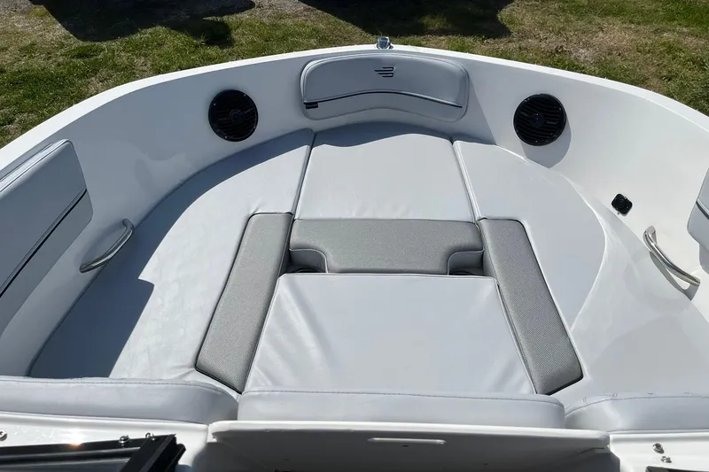 Slide: The Image of 2026 Bayliner VR6 Bowrider OB interior with cushioned seating and speakers. - 16