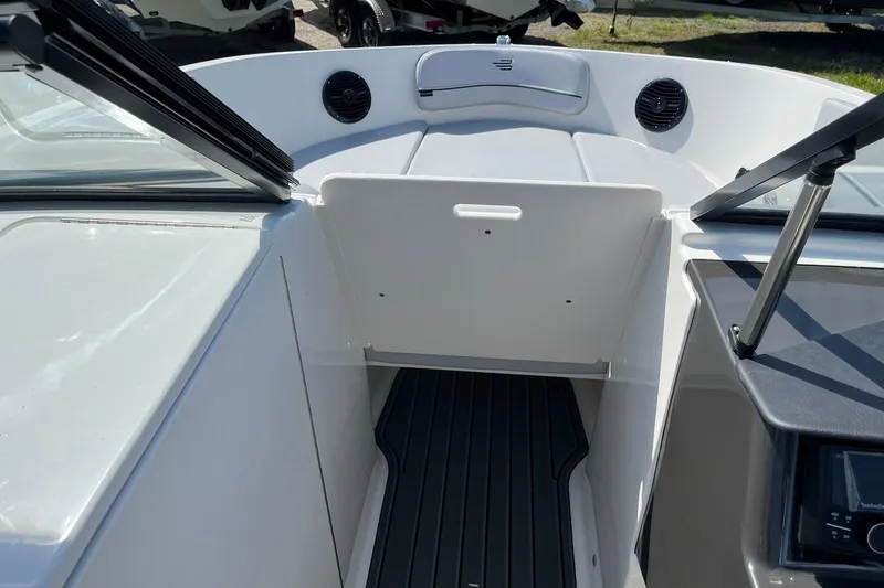 Slide: The Image of 2026 Bayliner VR6 Bowrider OB interior with open bow access and seating area. - 17