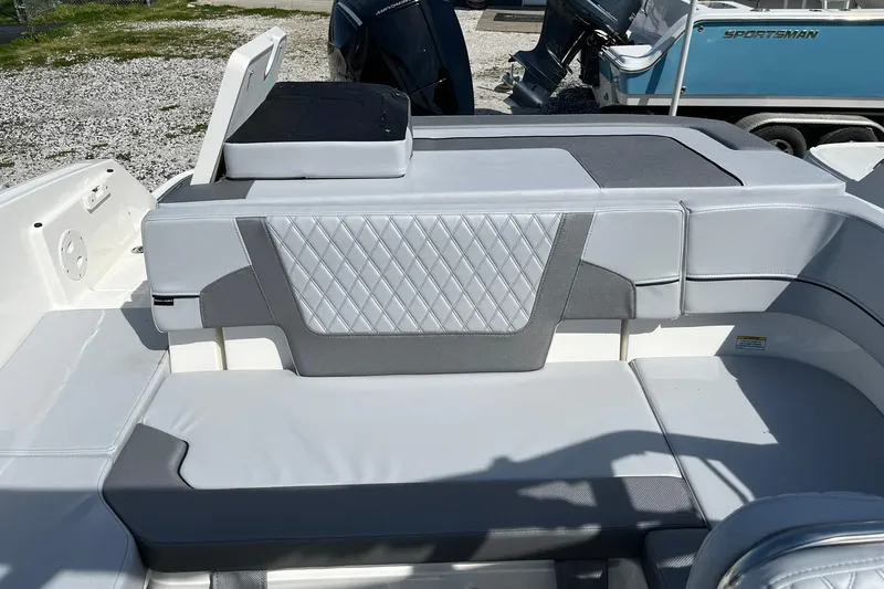 Slide: The Image of 2026 Bayliner VR6 Bowrider OB interior with gray and white seating, diamond pattern upholstery. - 7