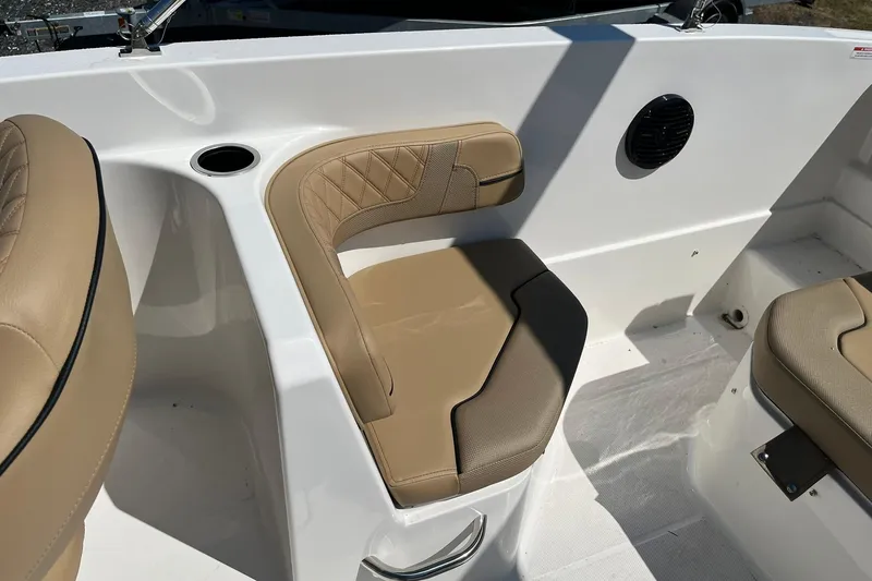 Slide: The Image of 2026 Bayliner VR6 Bowrider OB interior with tan seating and cup holder. - 14