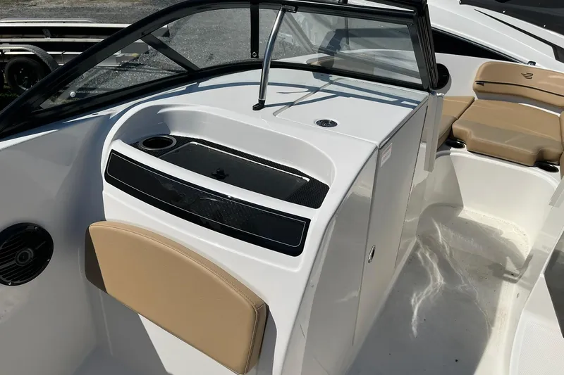 Slide: The Image of 2026 Bayliner VR6 Bowrider OB interior with beige seating and sleek dashboard design. - 17