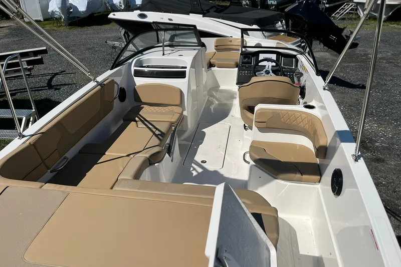 Slide: The Image of 2026 Bayliner VR6 Bowrider OB with spacious tan seating and modern dashboard. - 8