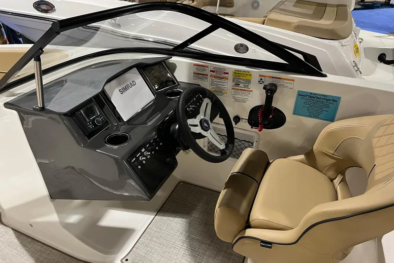 Slide: The Image of 2026 Bayliner VR6 Bowrider OB cockpit with steering wheel and control panel. - 10
