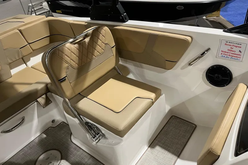 Slide: The Image of 2026 Bayliner VR6 Bowrider OB interior with tan seating and modern design. - 9