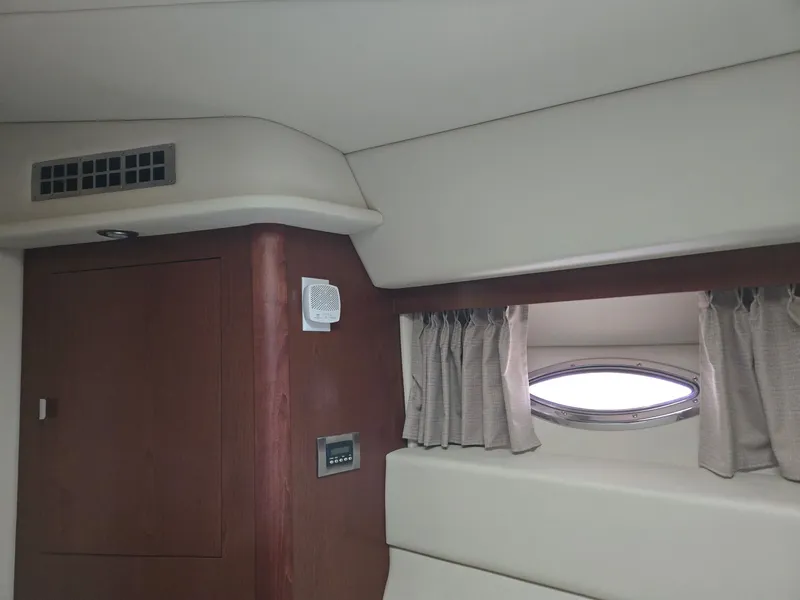 Slide: The Image of Interior of 2007 Sea Ray 36 Sedan Bridge with window and curtains. - 15