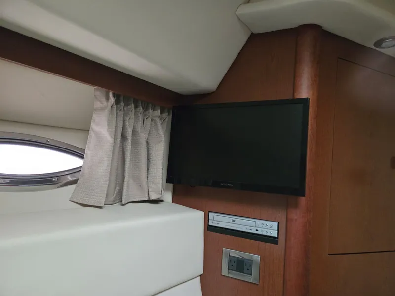 Slide: The Image of Interior of 2007 Sea Ray 36 Sedan Bridge with TV and window. - 19