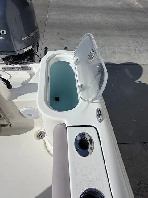 Slide: The Image of 2020 Key West 244 Center Console boat with open storage compartment. - 26