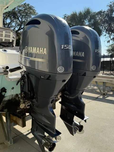 Slide: The Image of Two Yamaha 150 outboard motors on a Key West 244 Center Console boat. - 6