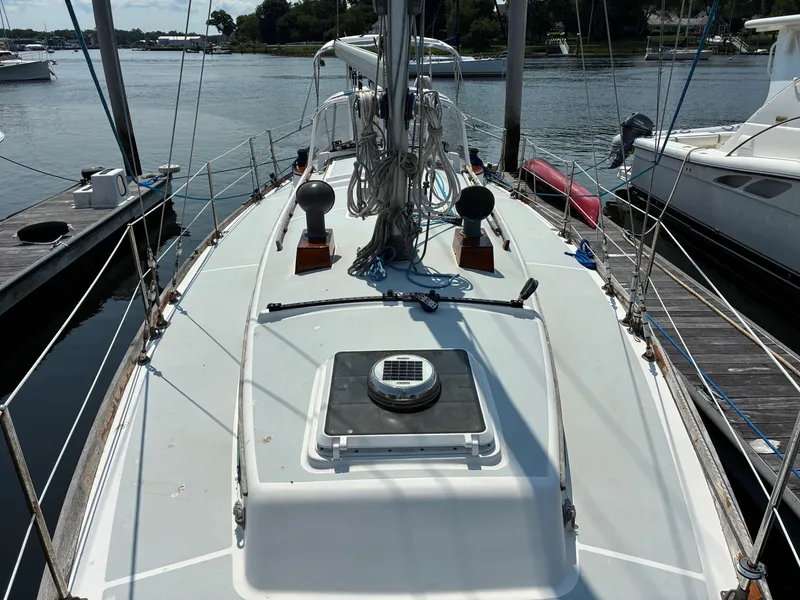 Slide: The Image of Cape Dory Robinhood 36 sailboat from 2001, docked with a clean deck and rigging. - 22