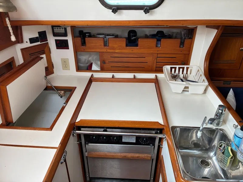 Slide: The Image of Interior of the 2001 Cape Dory Robinhood 36 featuring a galley and sink. - 44