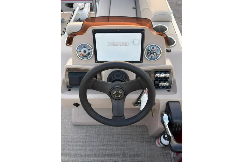 Slide: The Image of Steering console of 2021 Avalon VENTURE 1875 boat with Simrad display and controls. - 13
