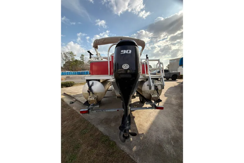 Slide: The Image of 2021 Avalon VENTURE 1875 pontoon boat with 90 HP outboard motor on trailer. - 5