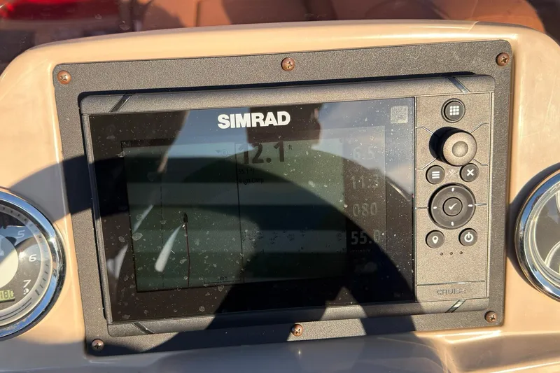 Slide: The Image of Simrad display on 2021 Avalon VENTURE 1875 boat dashboard, showing navigation data. - 8