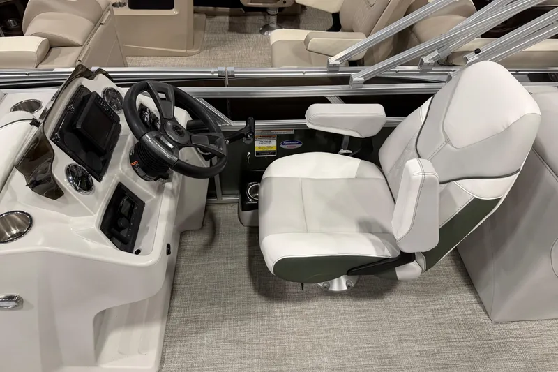Slide: The Image of 2025 Avalon 2385 VENTURE QL boat interior with steering console and captain's chair. - 5